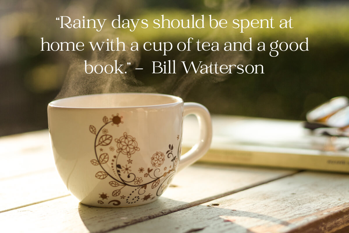 "Rainy days should be spent at home with a cup of tea and a book" quote with a brown and white floral teacup.