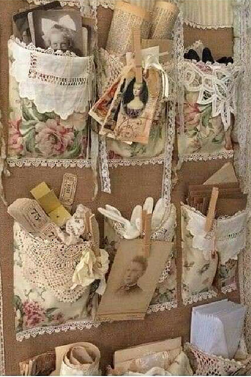 Pockets of fabric and lace added to corkboard for wall art and storage.