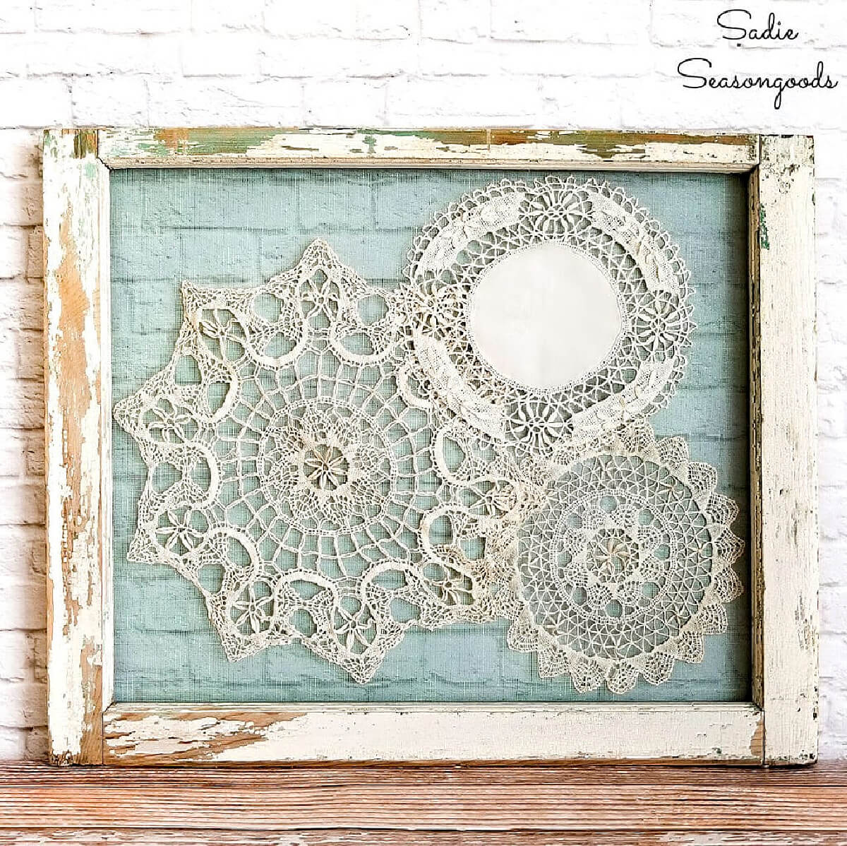 Add doilies and lace to a vintage picture frame to use as wall art.