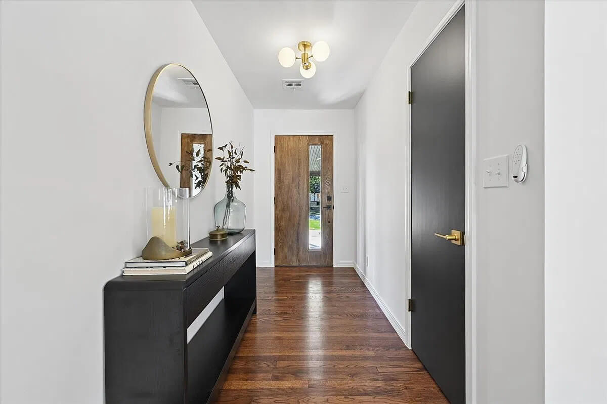 The hoarder house has been transformed, and this is the entryway.