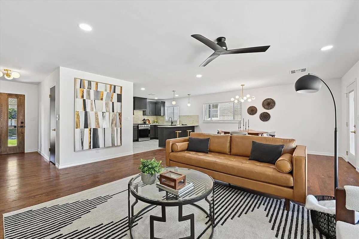 Another angle of the living room staged with mid-century furniture.