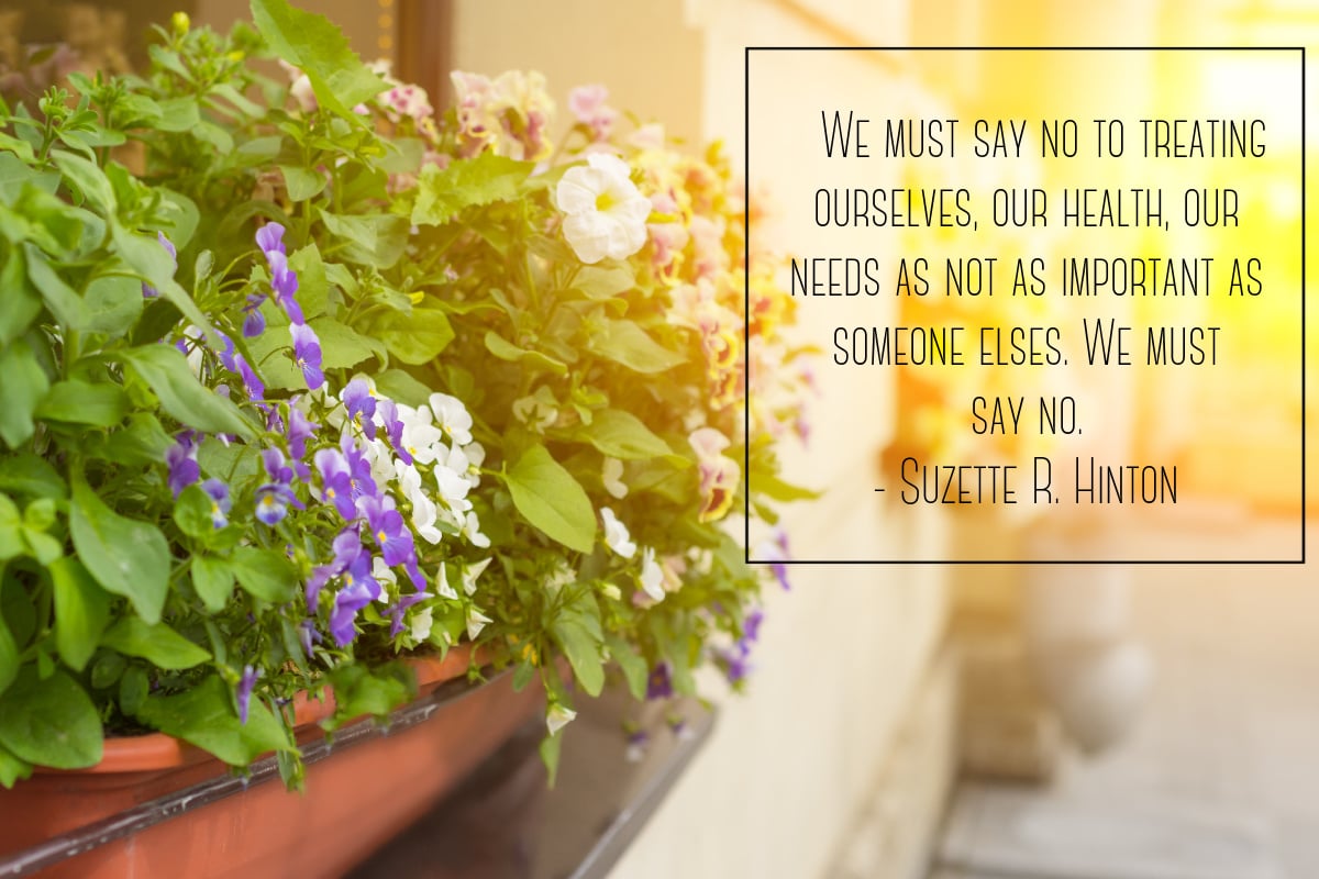 Learning to say no is better for our health. This scene shows a pot of pansies and a quote.